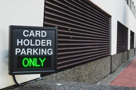 Card holder parking only sign photo