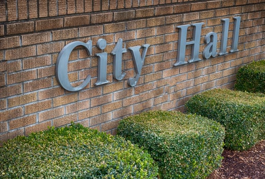 City Hall sign on a brick wall photo