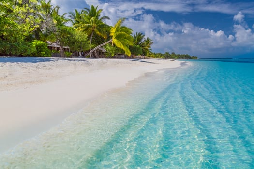 Beautiful beach. Tropical beach background as summer landscape, white sand and calm sea for beach banner. Perfect beach scene vacation and summer holiday concept. Boost up color process photo