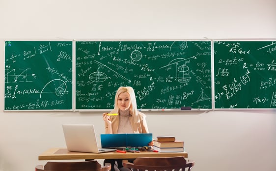 Teacher is skilled leader, Student looks for studying method that suits his learning style, Modern teacher hipster writing on big blackboard with math formula, Some students learn best by listening, photo