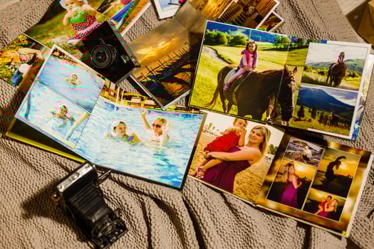 Photo album with photos of travel and vintage old camera on a background
