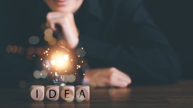 for Concept new idea, concept with innovation and inspiration, innovative technology in science concept and modern business development,creative idea,Wooden blocks and light bulbs on the table photo