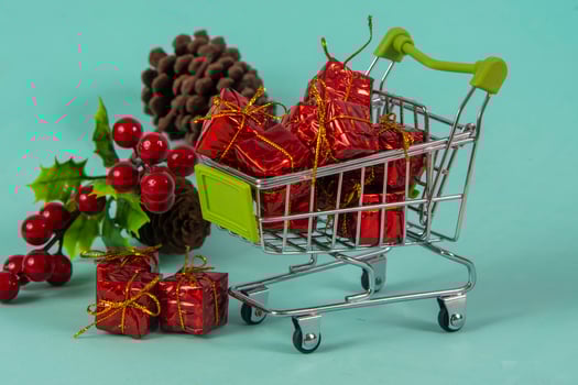 Christmas shopping cart with gifts and Christmas photo