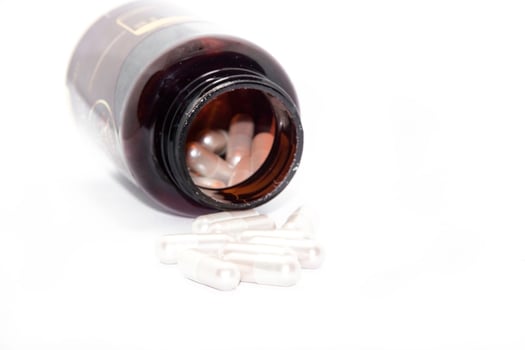 Tablets are capsules on a white background as a supplement and nourish the human body. photo