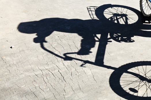shadow of bicyclist on road photo