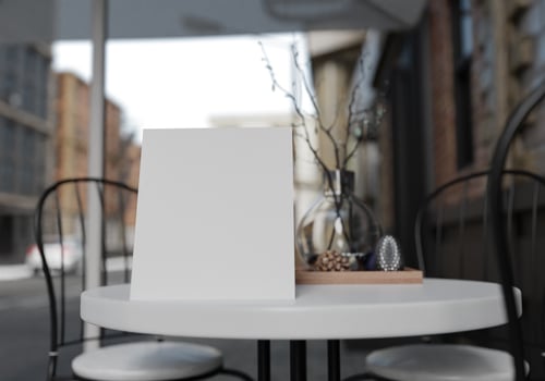 3D mockup blank menu board on table of coffee shop rendering photo
