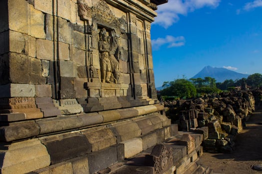 Candi Plaosan, a Buddhist temple located in Klaten Central Java, Indonesia, with a background of Mount Merapi photo