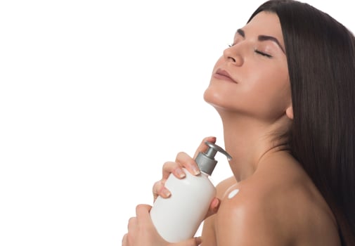 Body Care. Woman Applying Moisturizing Lotion Or Cream on her body photo