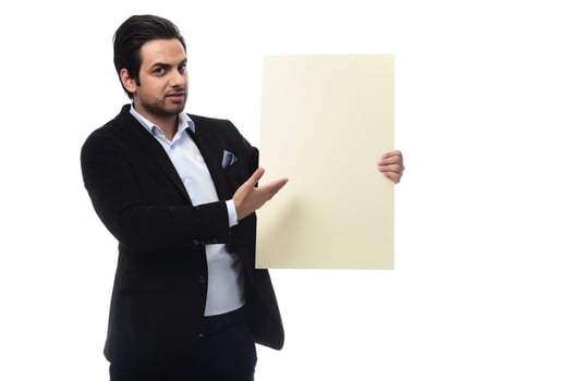 Arab businessman holding white board. advertisement concept. isolated photo