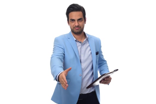 Arab businessman shaking hand for closing a deal. isolated photo