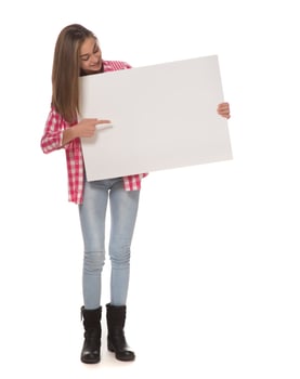 young smiling woman holding a blank sheet of paper for advertising photo