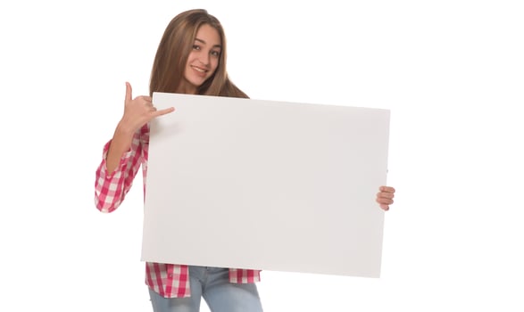 young smiling woman holding a blank sheet of paper for advertising photo
