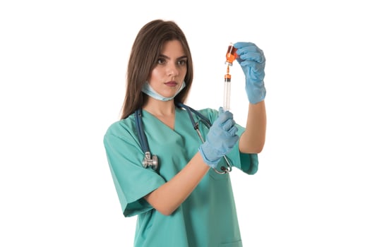 Woman Nurse with protective workwear holding Vaccine and syringe photo