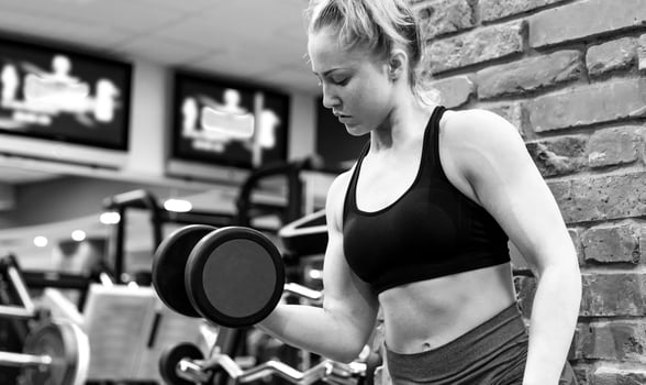 beautiful girl work out at the gym photo