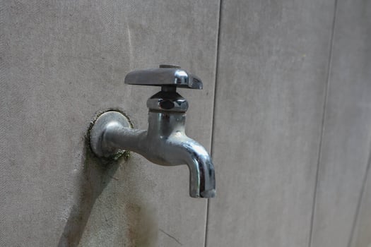 water faucet or water tab on ceramic wall photo