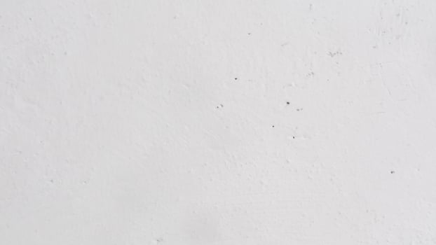 texture of concrete wall with white paint as background photo