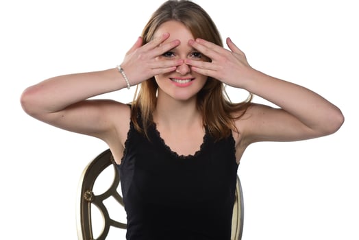 Close up studio portrait of cheerful blonde hipster girl going crazy making funny face photo