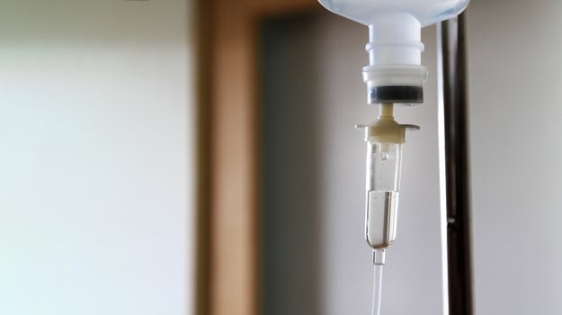 Close up intravenous fluid infusion during advanced surgery in operating room at hospital. Saline pump drip to blood loss patient people with copy space. Medical or medicine, repair healthy and cure photo