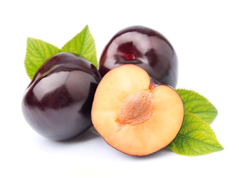 Ripe plums with leaves photo