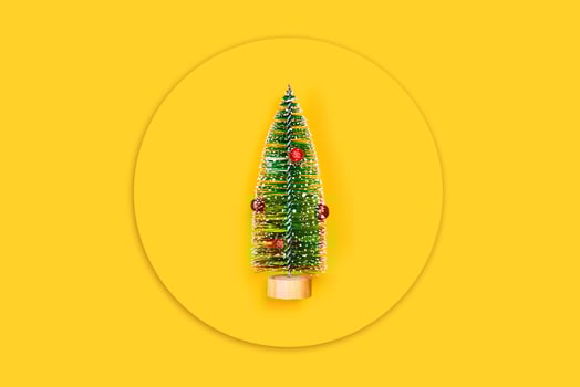 Yellow background with christmas tree. photo