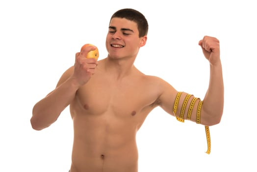 male model with great body measuring his body with measuring tape photo