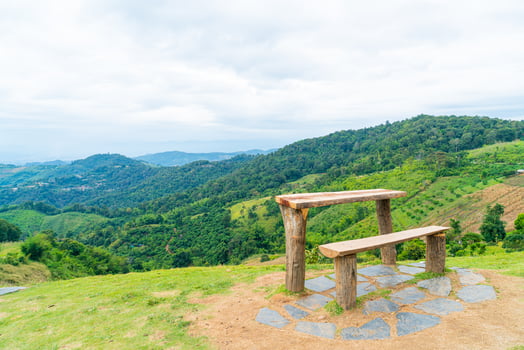 wood bar and chair with mountain hill background photo
