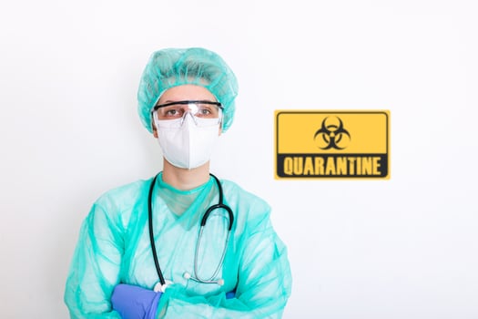 Portrait of doctor, nurse in protective clothes during coronavirus pandemic next to quarantine sign. Epidemic, pandemic of coronavirus covid 19. Doctor, patient in respirator. photo