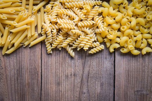Pasta background, raw macaroni texture background, penne pasta and spiral pasta uncooked delicious pasta for cooking food photo