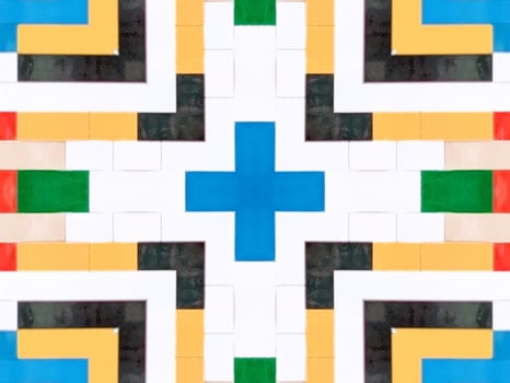 A colorful brick kaleidoscope background. Symmetric abstract and aesthetic pattern photo