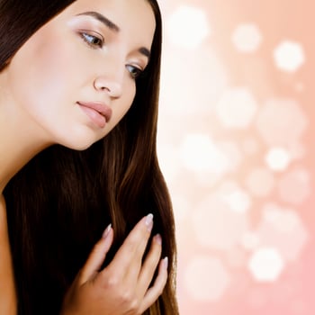 woman with long dark hair, blurred background photo
