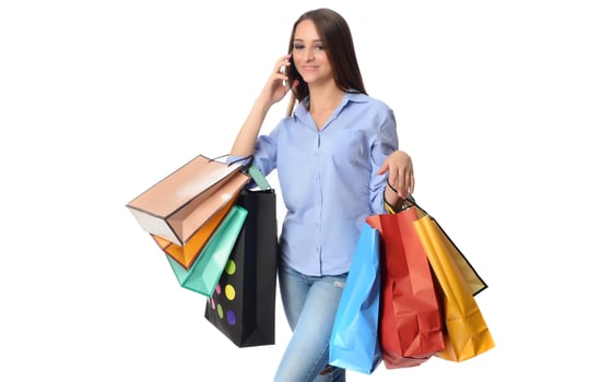 Beautiful smiling brunette with shopping bags photo