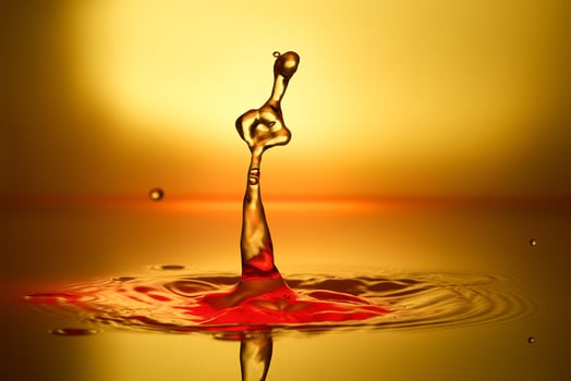 splash of water on a yellow background photo