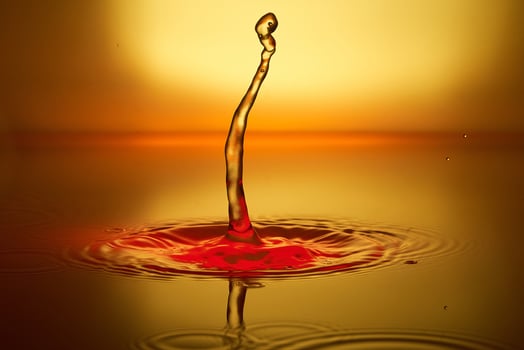 splash of water on a yellow background photo