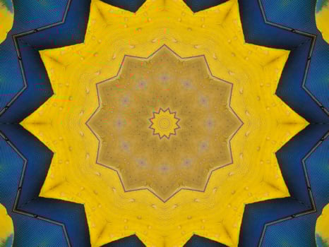 Yellow feather kaleidoscope floral pattern with some blue and red color. Abstract unique and aesthetic background. photo