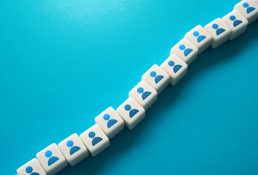 A chain of blocks with symbols of people. Human resources and work force. Staffing and recruiting candidates. Communication between employees. Building technological chains and working relationships. photo