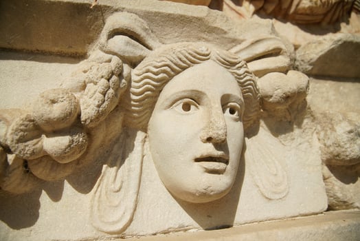 Ancient Mask Relief in Aphrodisias Ancient City in Aydin, Turkiye photo