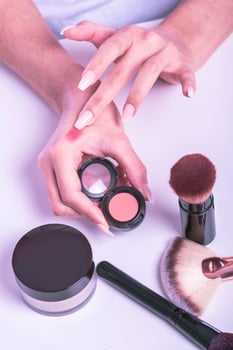 Decorative cosmetics and makeup brushes photo