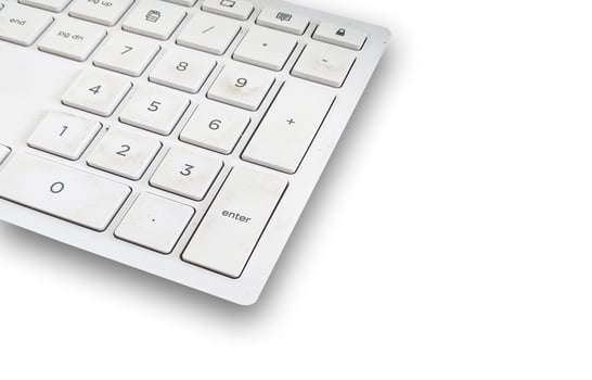 Close up Plastic Keyboard on a white background. photo
