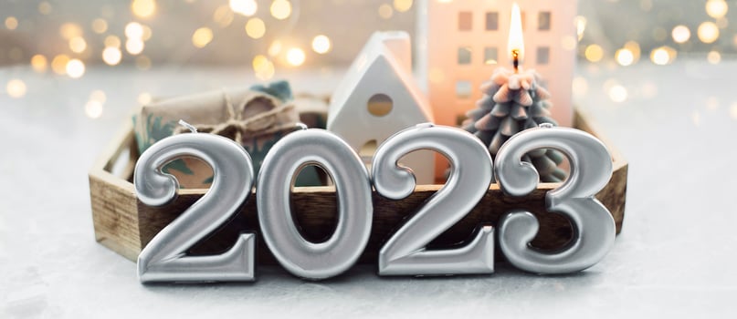 Christmas and New Year card. Number 2023 on holiday background. Christmas lights bokeh background. Holiday postcard. Happy New Year 2023 Card Concept photo
