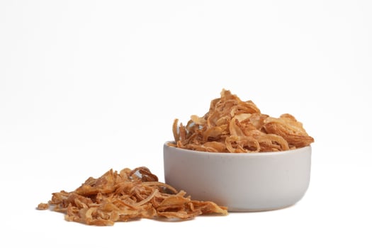 Crispy fried onion slices on a white background photo