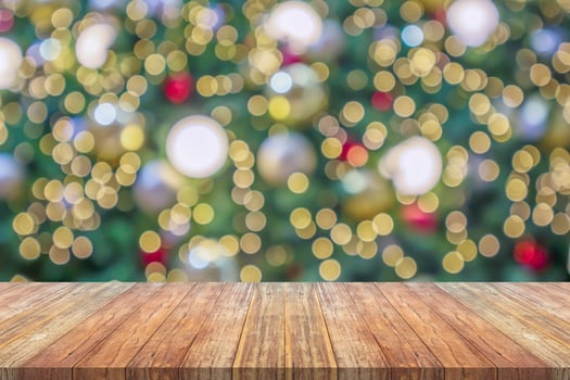 Empty wood table top with blur Christmas tree with bokeh light background photo