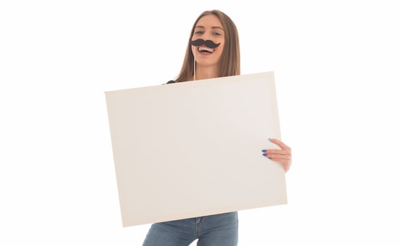 smiling girl holding blank sign board. studio portrait of young woman with sign card. isolated. photo