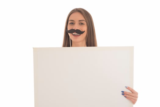smiling girl holding blank sign board. studio portrait of young woman with sign card. isolated. photo