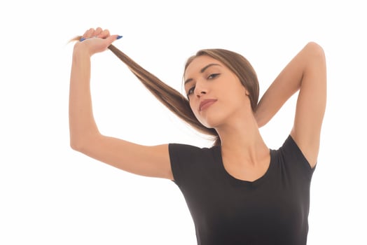 Young attractive smiling woman holding her strong hair photo