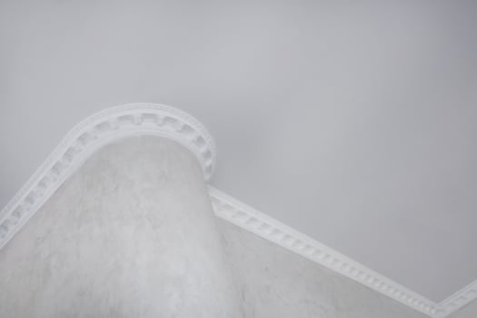 Detail of corner ceiling with intricate crown molding. photo