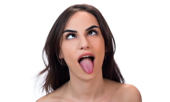 squint eyed woman with weird expression isolated on white photo