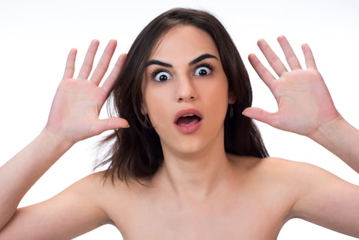 woman with weird expression isolated on white photo