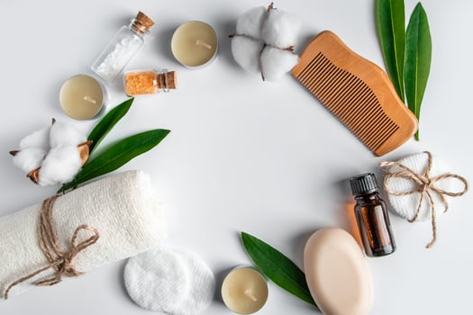 Set of natural cosmetics and spa accessories on white background. Towel, soap, hairbrush, essential oil. photo