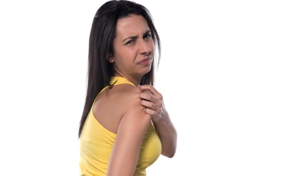 The person feels pain in the arm and shoulder and massages. photo