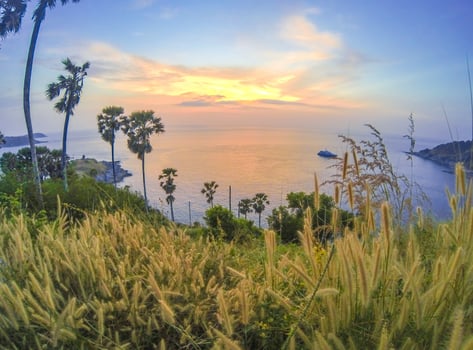 Phromthep cape viewpoint with twilight sky and sunset in Phuket, Thailand. Popular travel destination point for tourists. photo